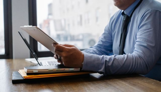 person analyzing reports in an office