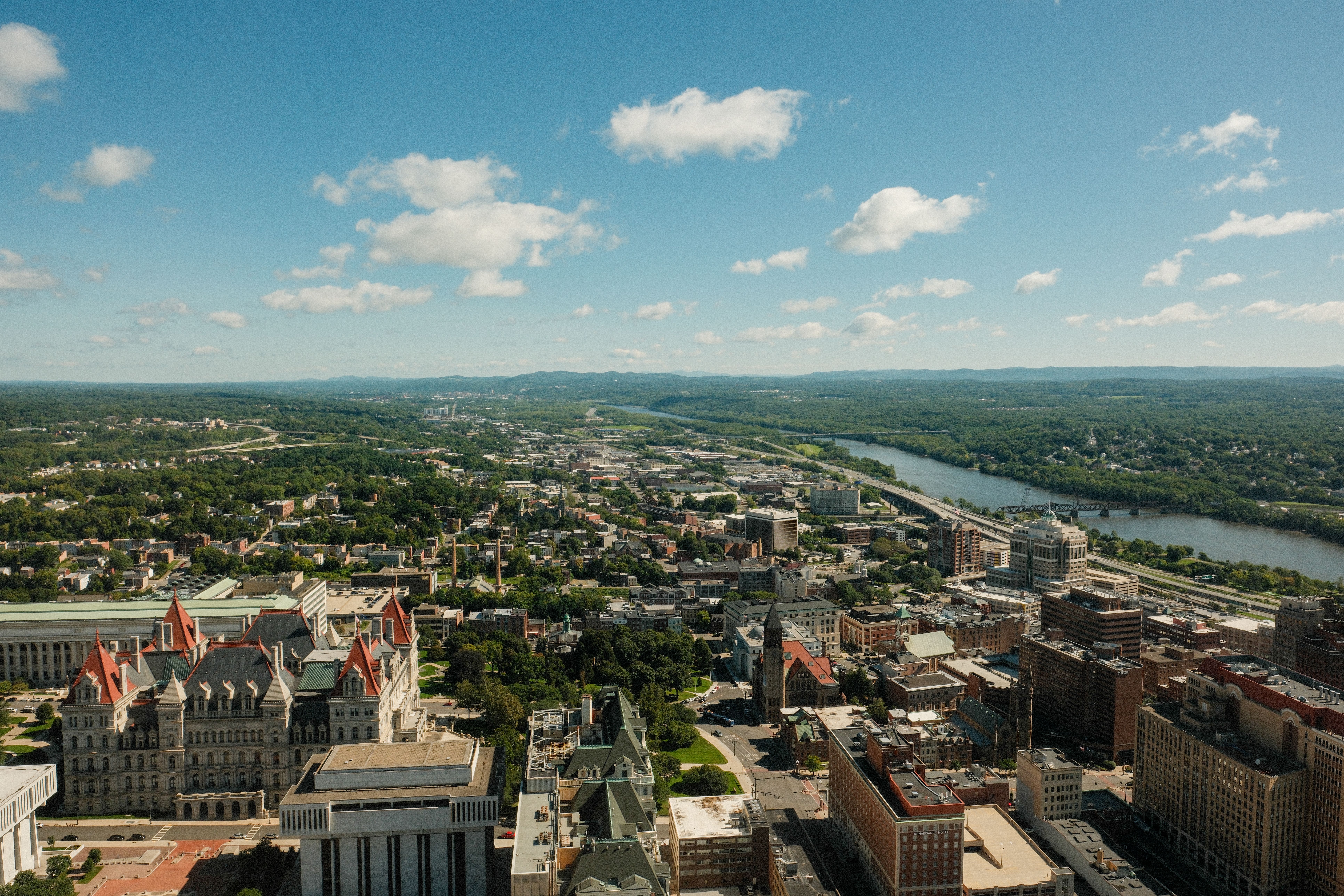 Stunning aerial shot of Albany cityscape and Hudson River on a clear day
